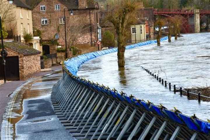 Flood-crisis town evacuated overnight amid fears barriers will buckle hours after defences failed ju |